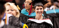 Graduate smiling at commencement