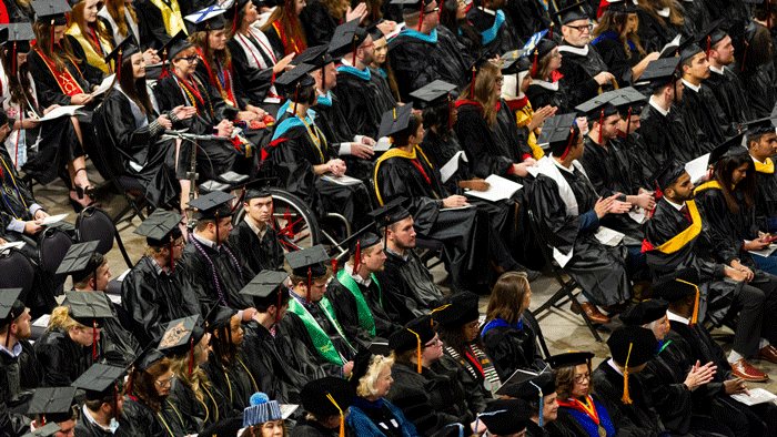 Graduates sit during commencement ceremony