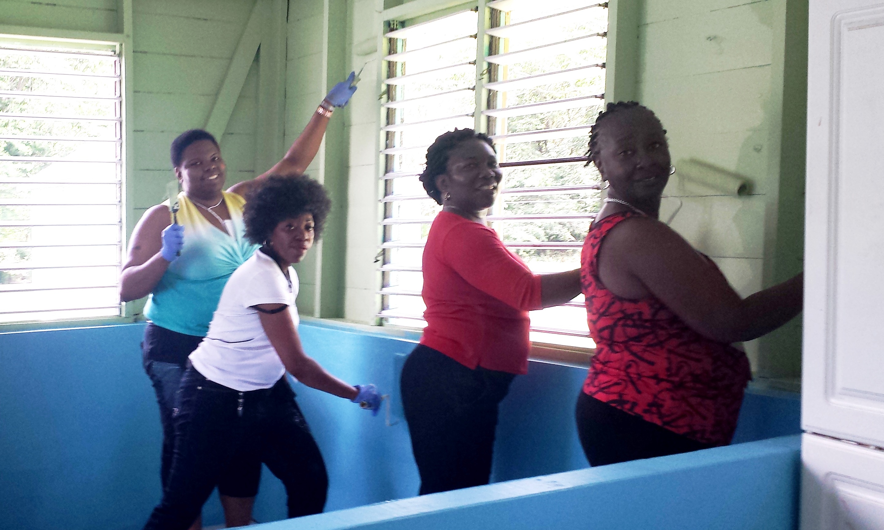Social Work - Jamaica Social Work faculty and student doing community service in Jamaica