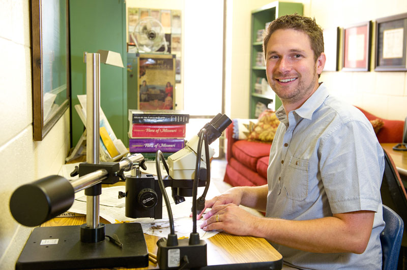 Dr. Travis Marsico at his desk