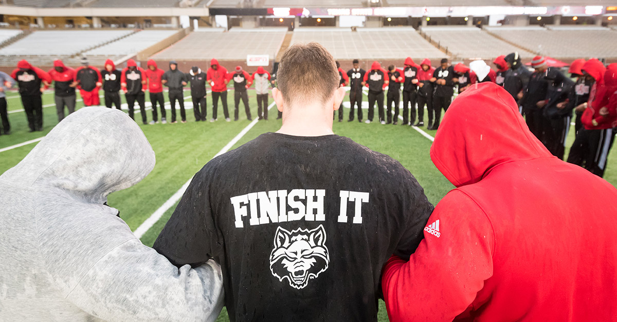 The Red Wolves huddle before the game