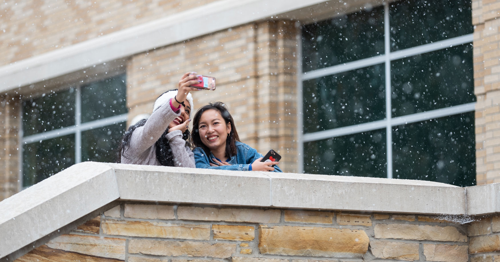 Students taking a selfie in the snow