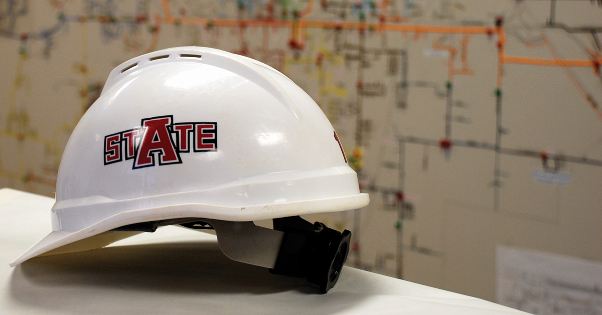 A white hard hat with an A-State logo on the side.