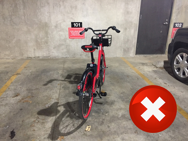 A bike locked to a light pole