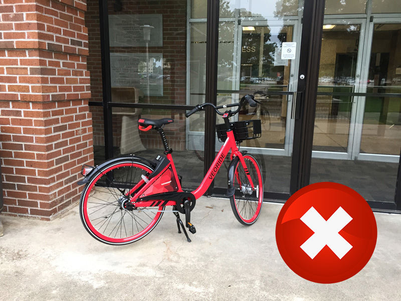 A bike locked to a handrail