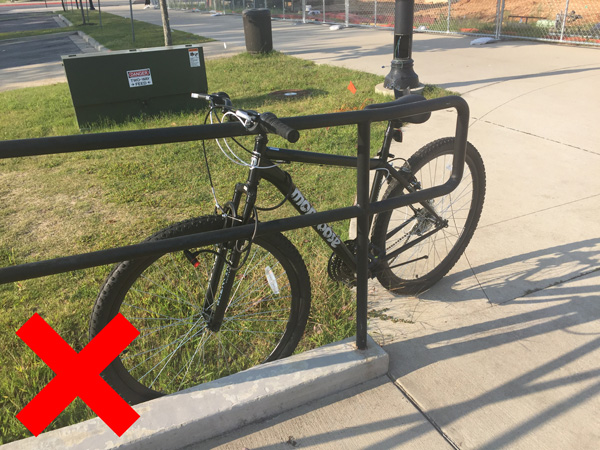 A bike locked to a handrail