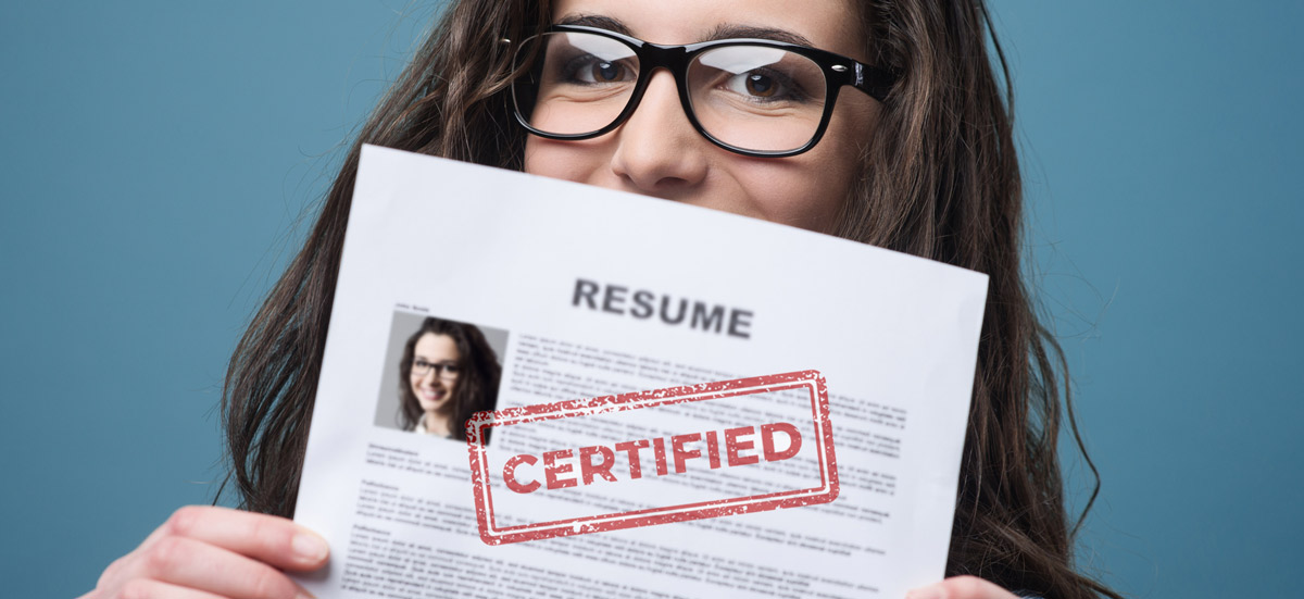 girl holding up a resume