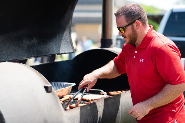 Grilling hotdogs for the staff picnic.