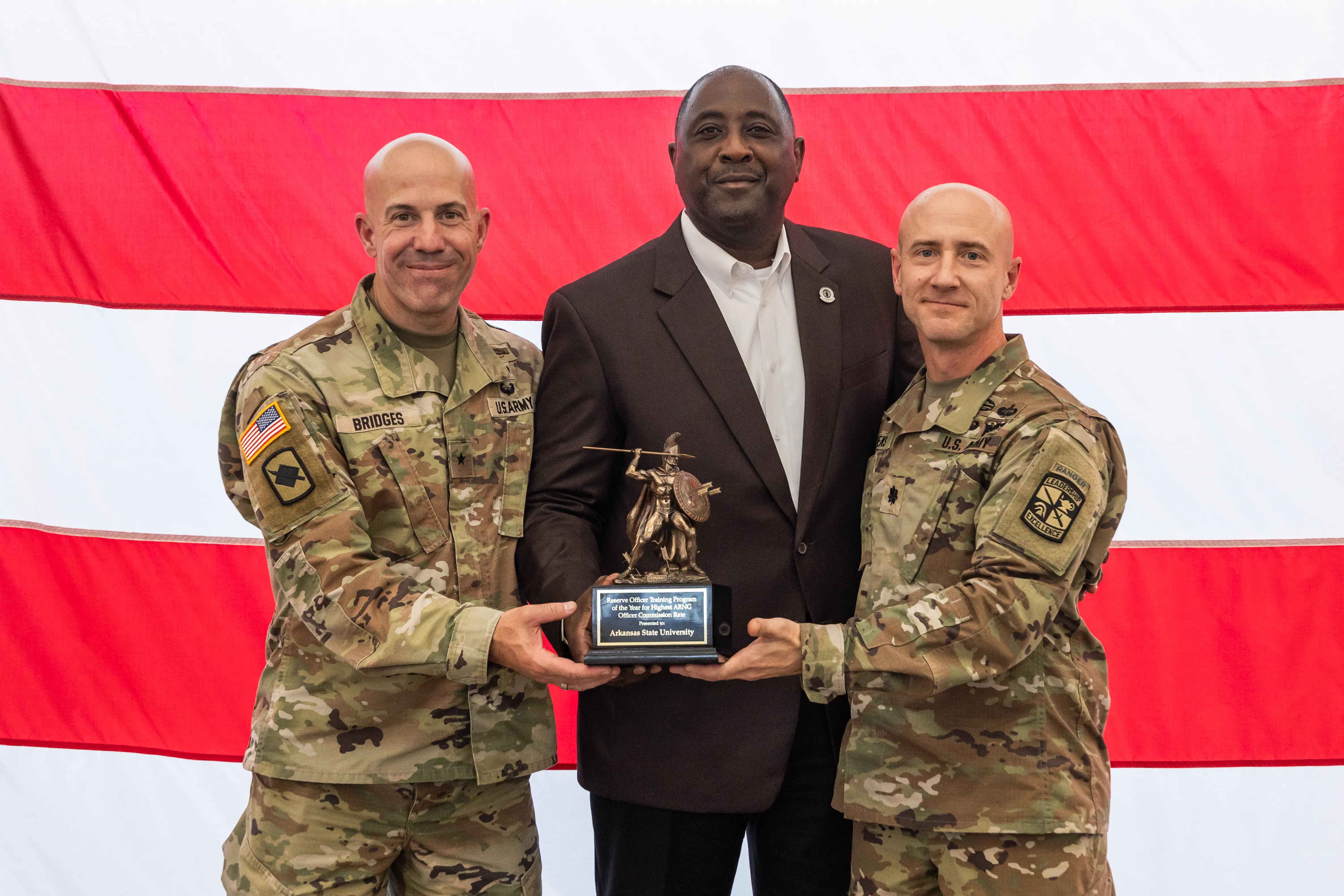 Dr. Calvin White receives an award on behalf of the university for having one of the highest producing ROTC programs in the country