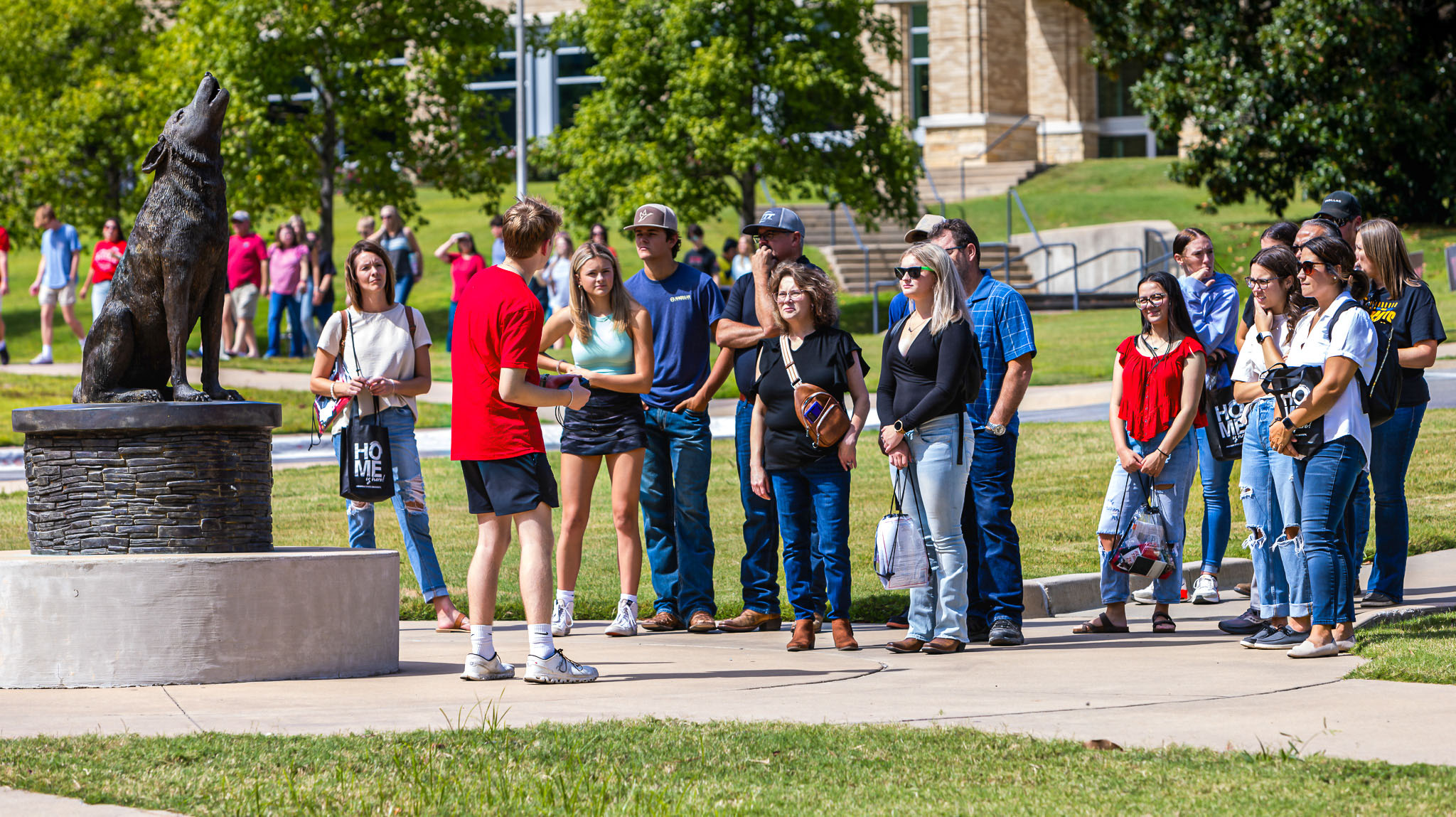 student giving group tour to prospective students and parents