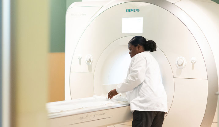 Student examines MRI machine