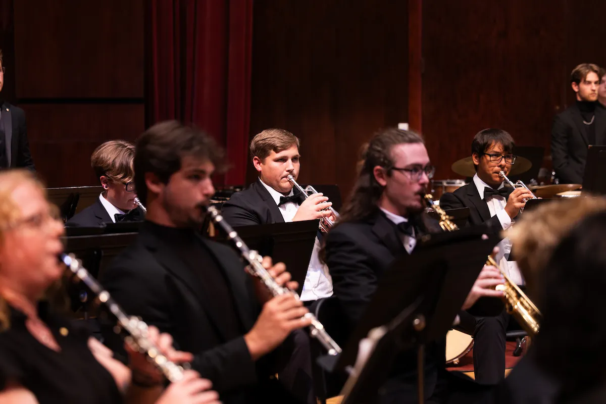 The wind ensemble performs