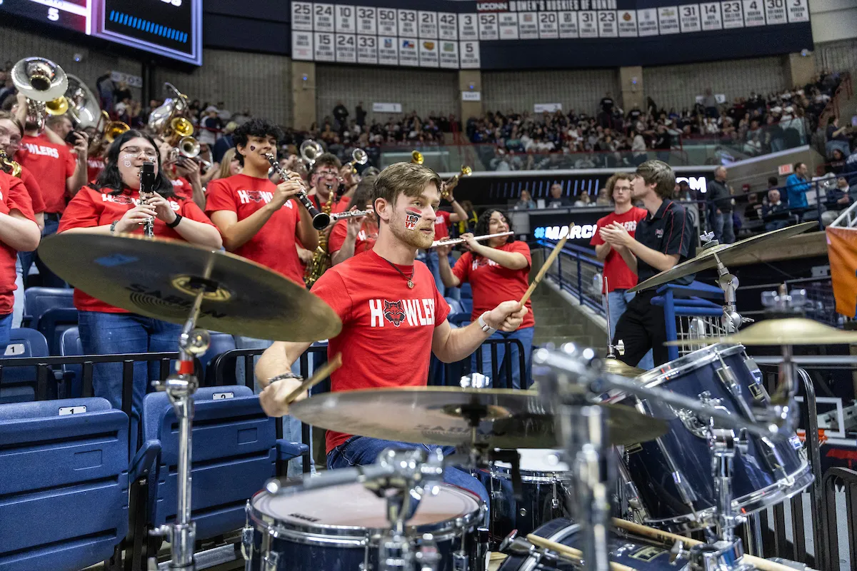 The howler pep band performs at a basketball game