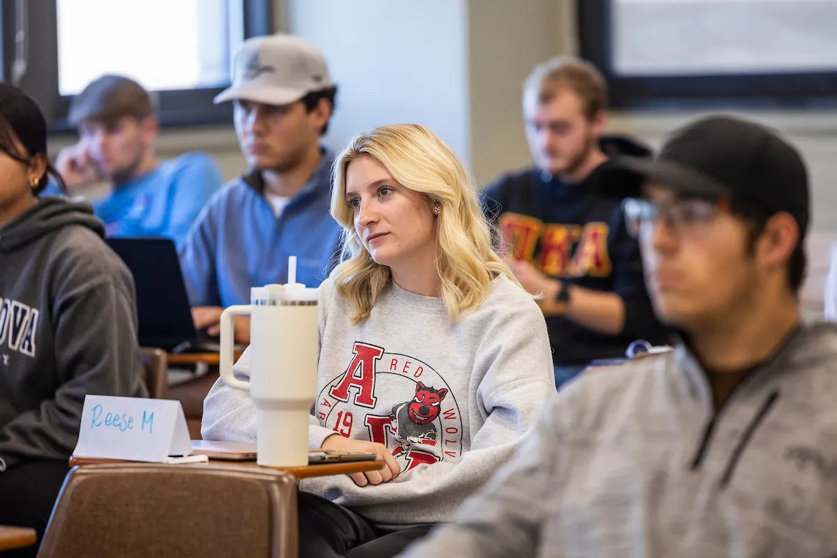 A student sits in class during a lecture