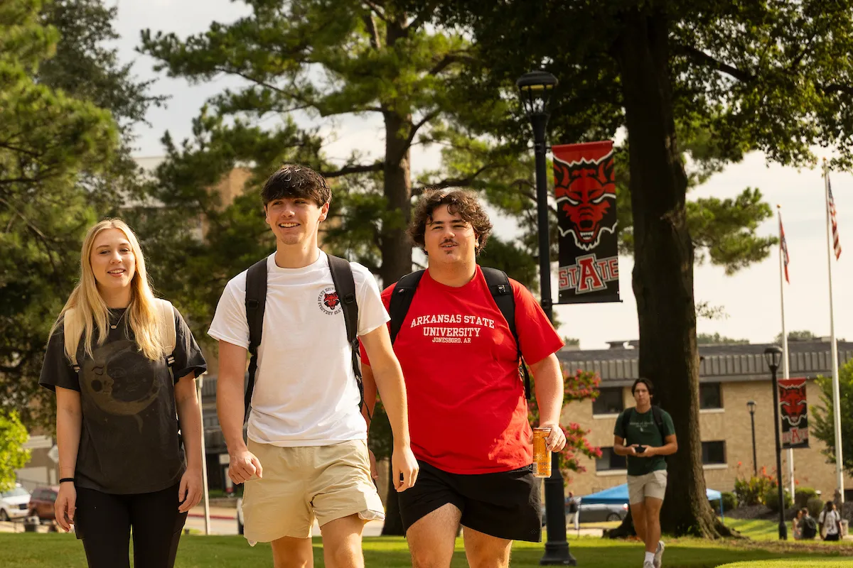 Three students walking on A-State's campus