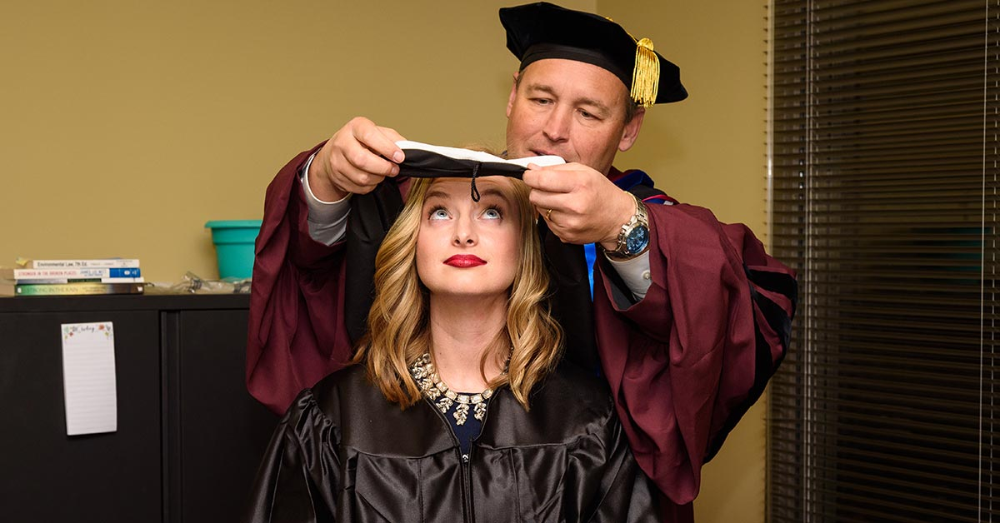 Chancellor Damphousse Makes Surprise Deliveries to Online Graduates