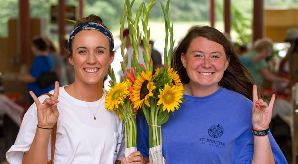 Two students shopping at the farmers' market