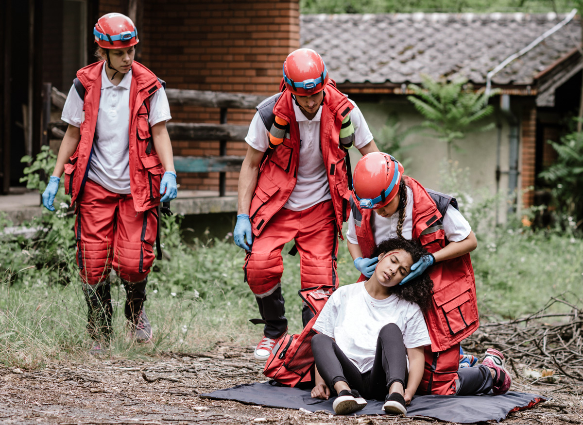 Emergency workers attend to bleeding woman