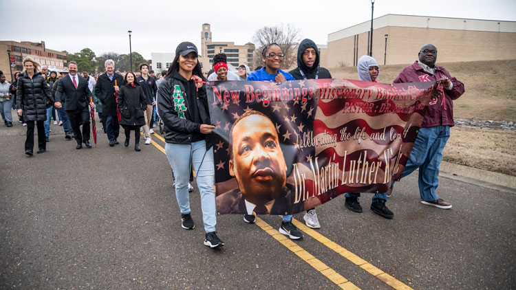 Participants walk in the 2023 parade