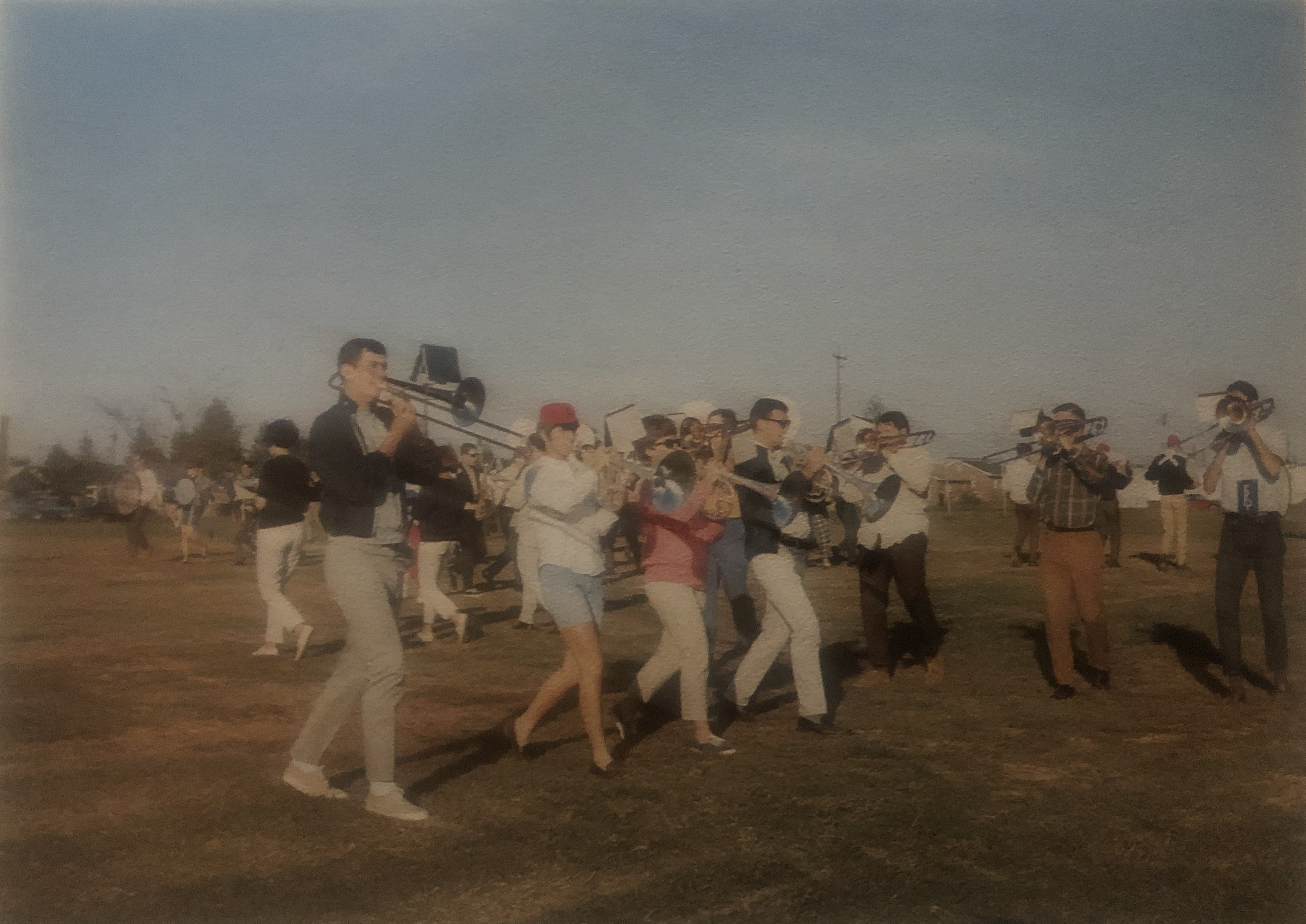 Marching Band outside on the practice field marching