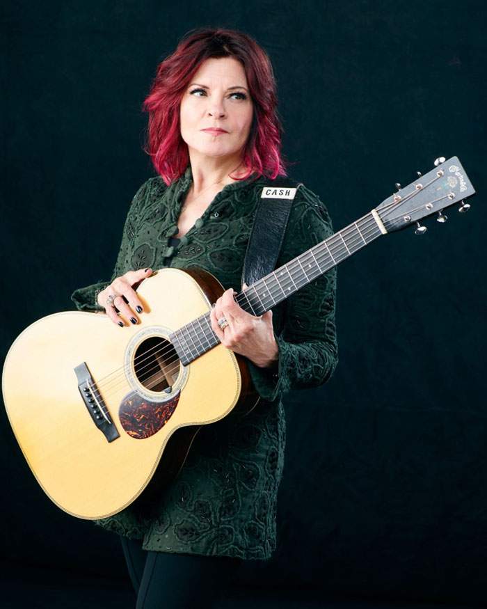 Rosanne Cash holding a guitar