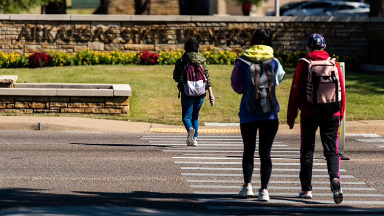 Students walk across campus at A-State
