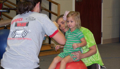 A-State Students Treating a Small Girl