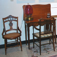 antique chairs and table in the Mary Stack Gallery