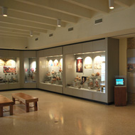 distant interior view of the Native American Gallery display cases