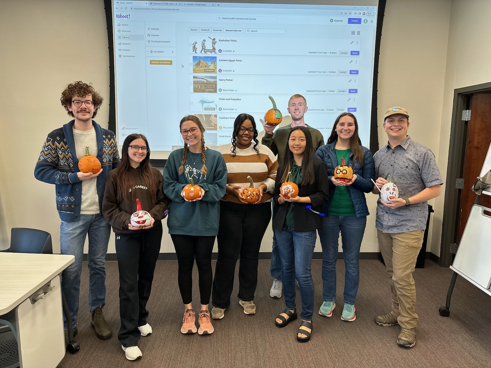 CoSM Ambassadors showing of their decorated pumpkins during the SMART Center Trivia Night