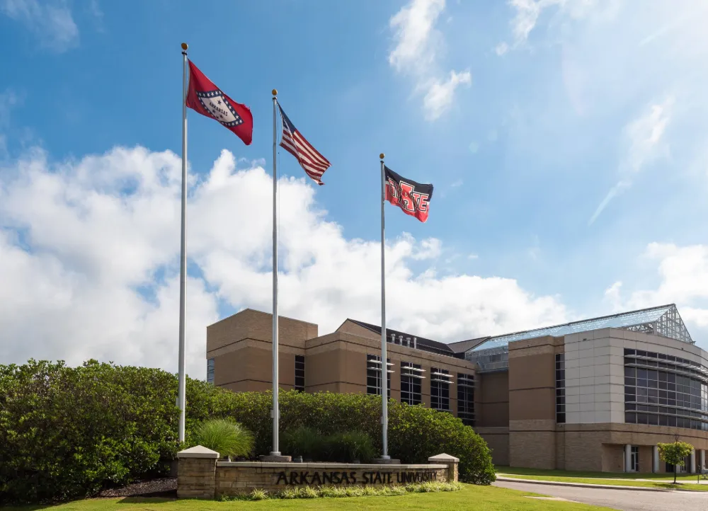 the front of the Arkansas Biosciences Institute building in the afternoon sun