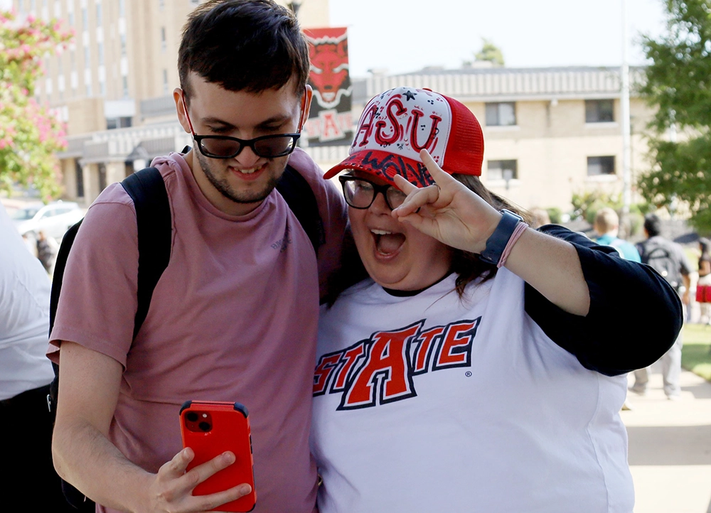 Two H.O.W.L. students taking a selfie together.