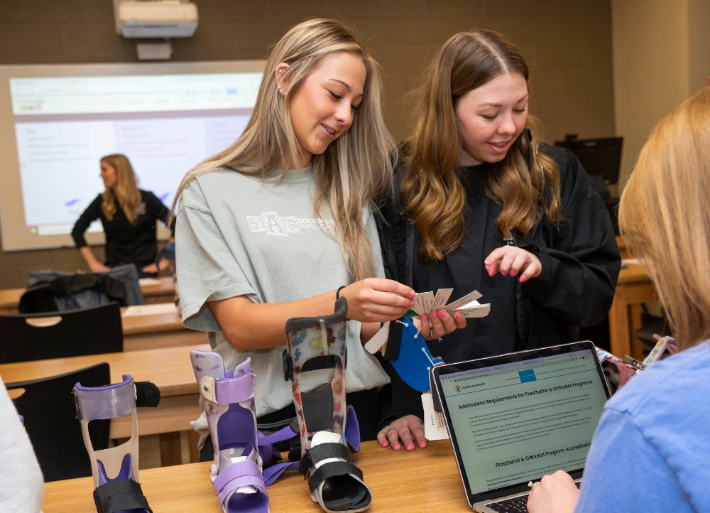 Physical Therapy students working on orthotic devices.