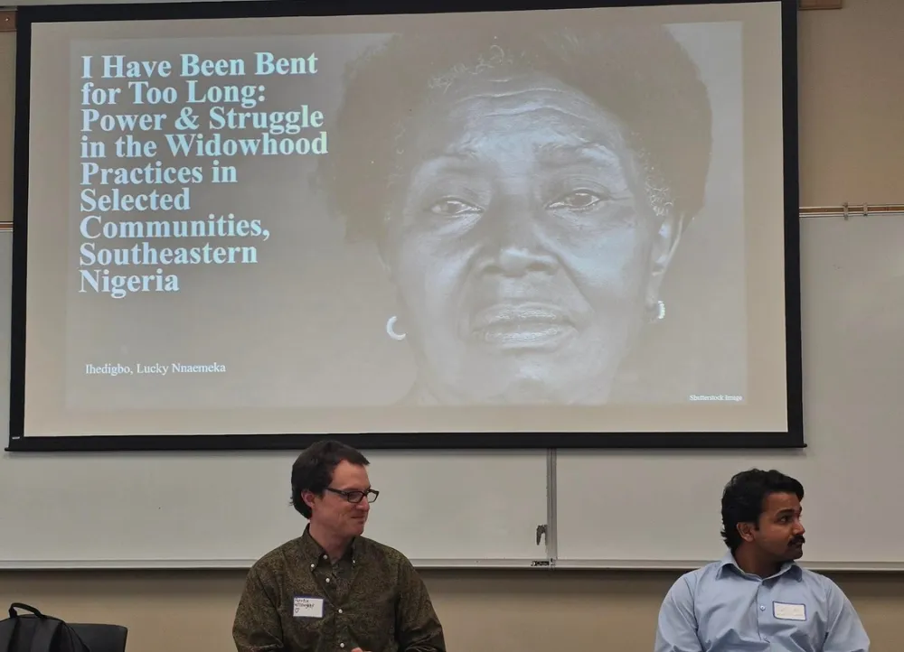 Lucky Ihedigbo presenting research with a slide titled: I have been bent for too long. 