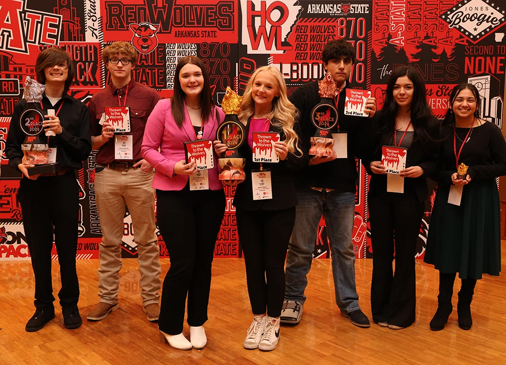 TTTW Student winners posing with their trophies.