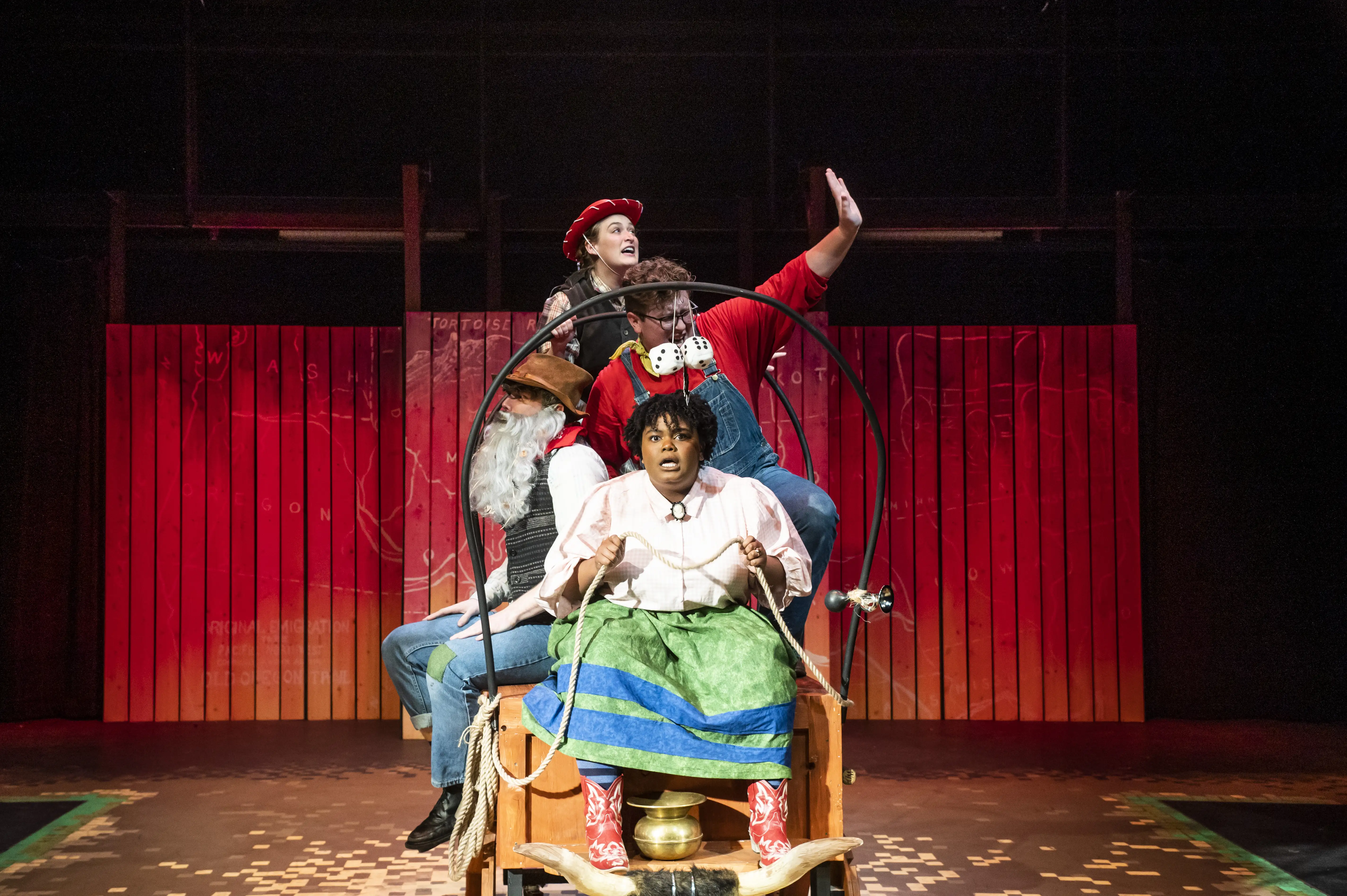 Student actors in a wagon during their performance of "The Trail to Oregon".