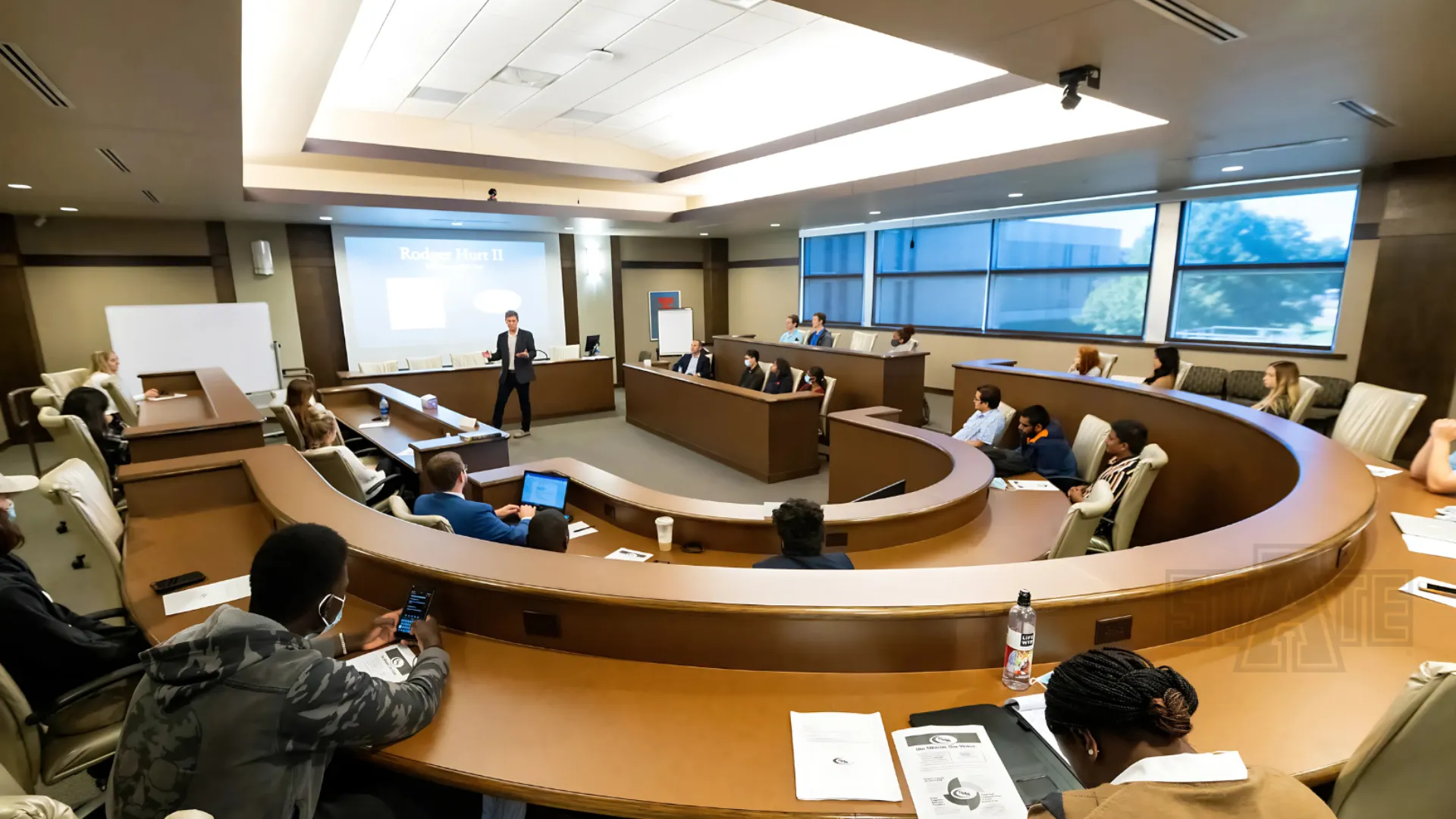 A-State students sitting in the bob wood sales leadership center in class.