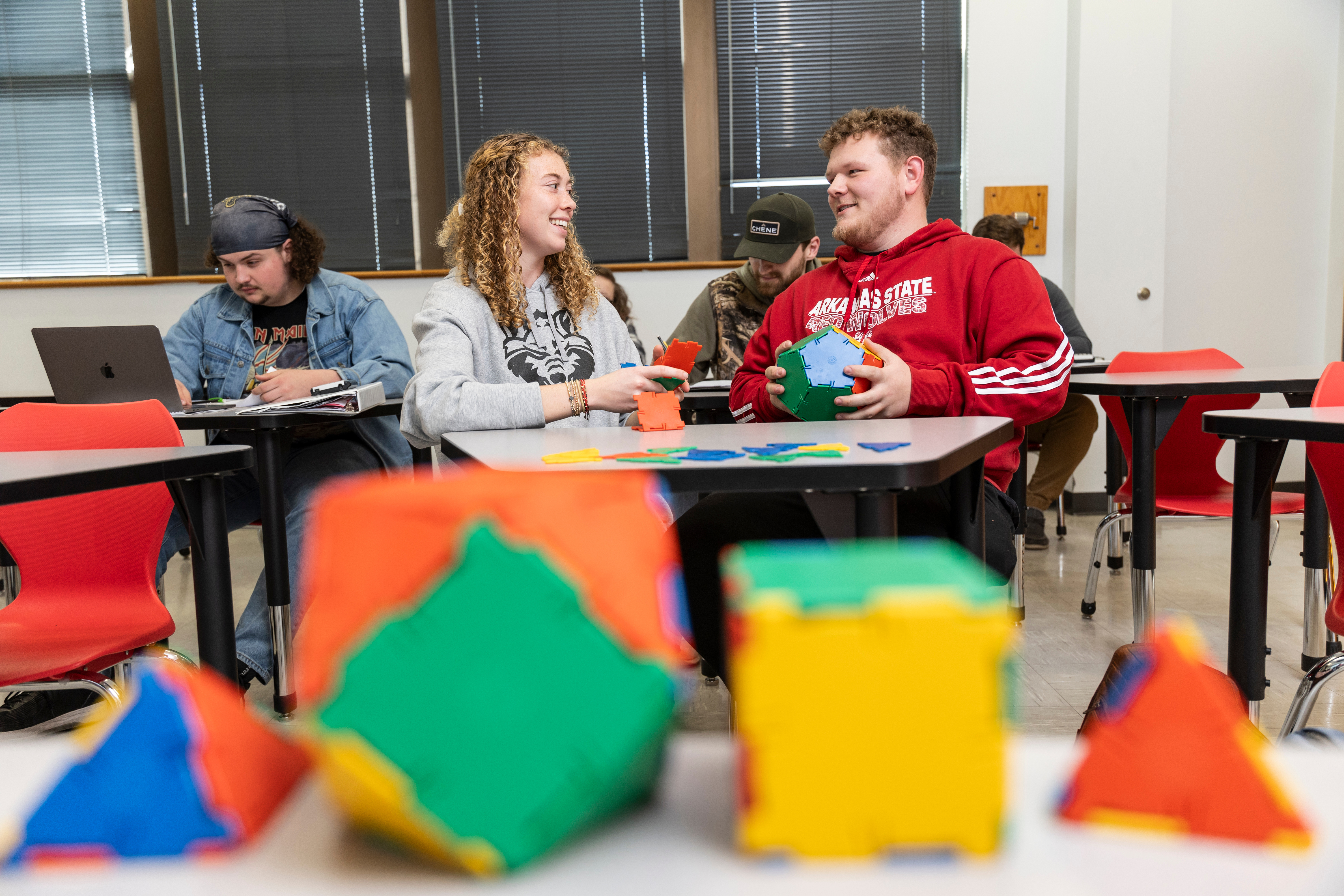 Students building 3D shapes.