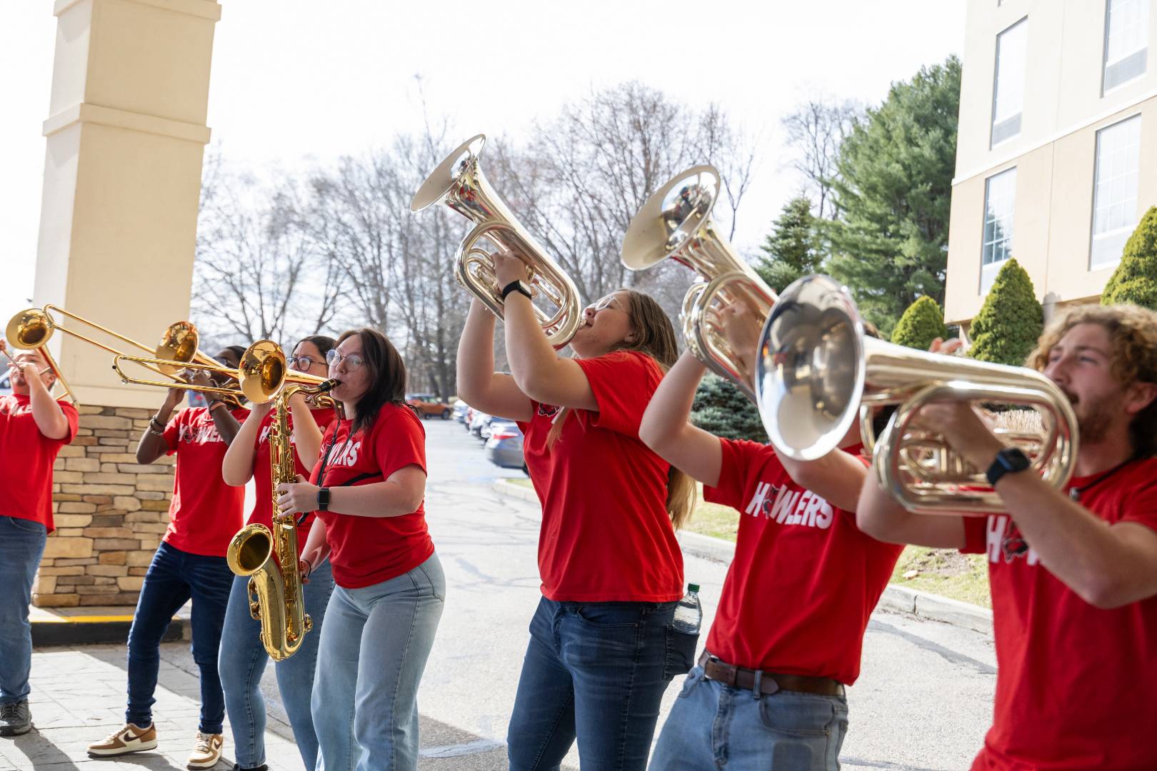 Brass players from A-State's band playing their instruments.