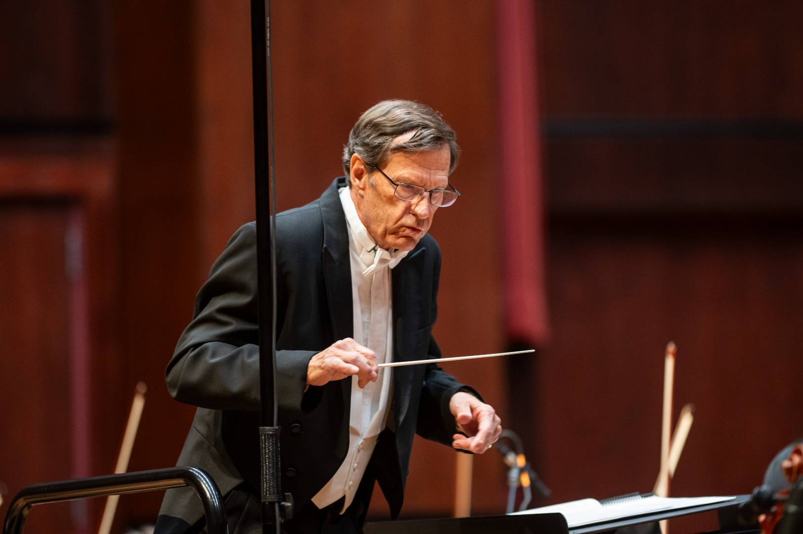 A man conducting the orchestra at A-State.