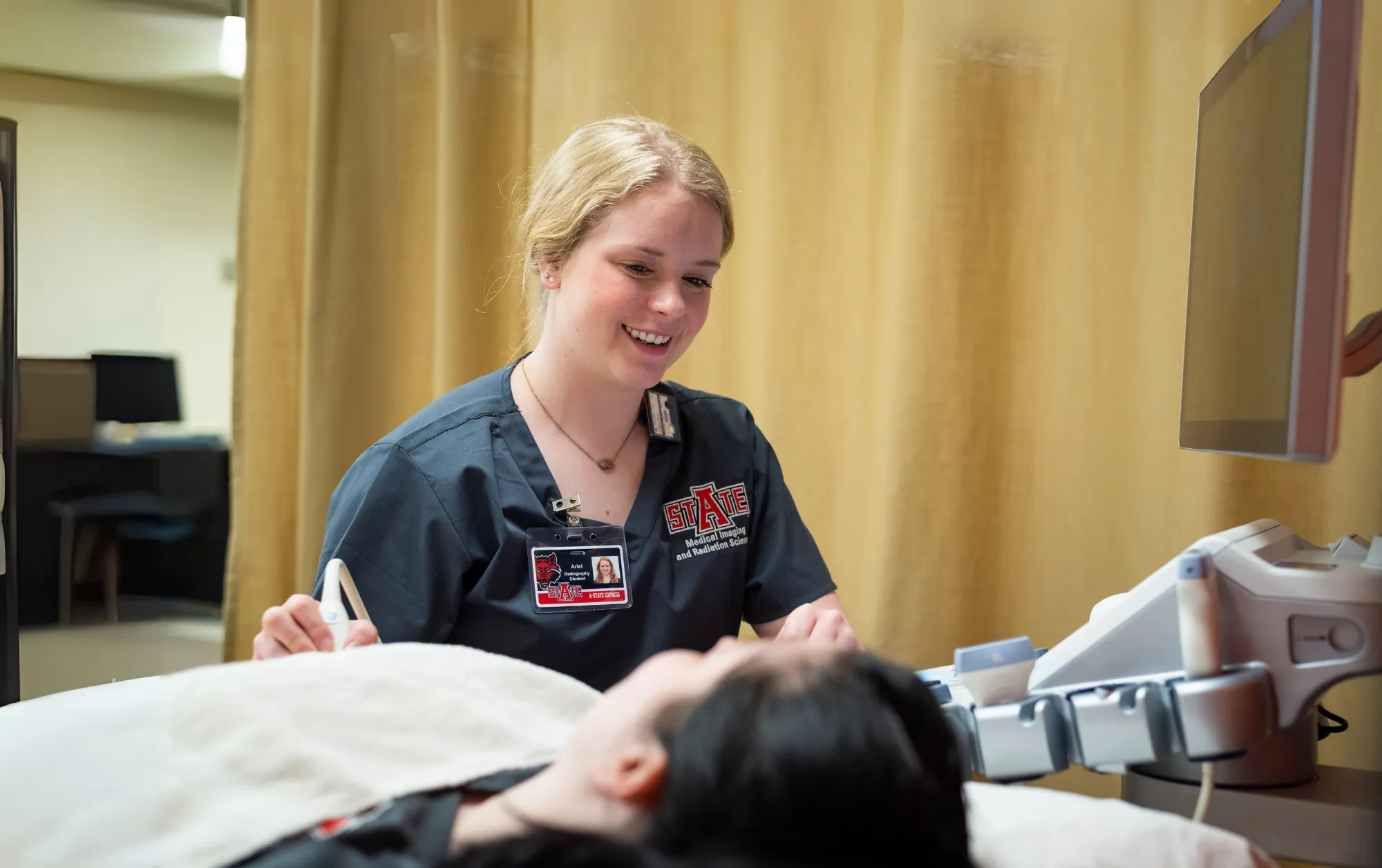 A-state students at a medical imaging and radiation sciences event on campus community fair.