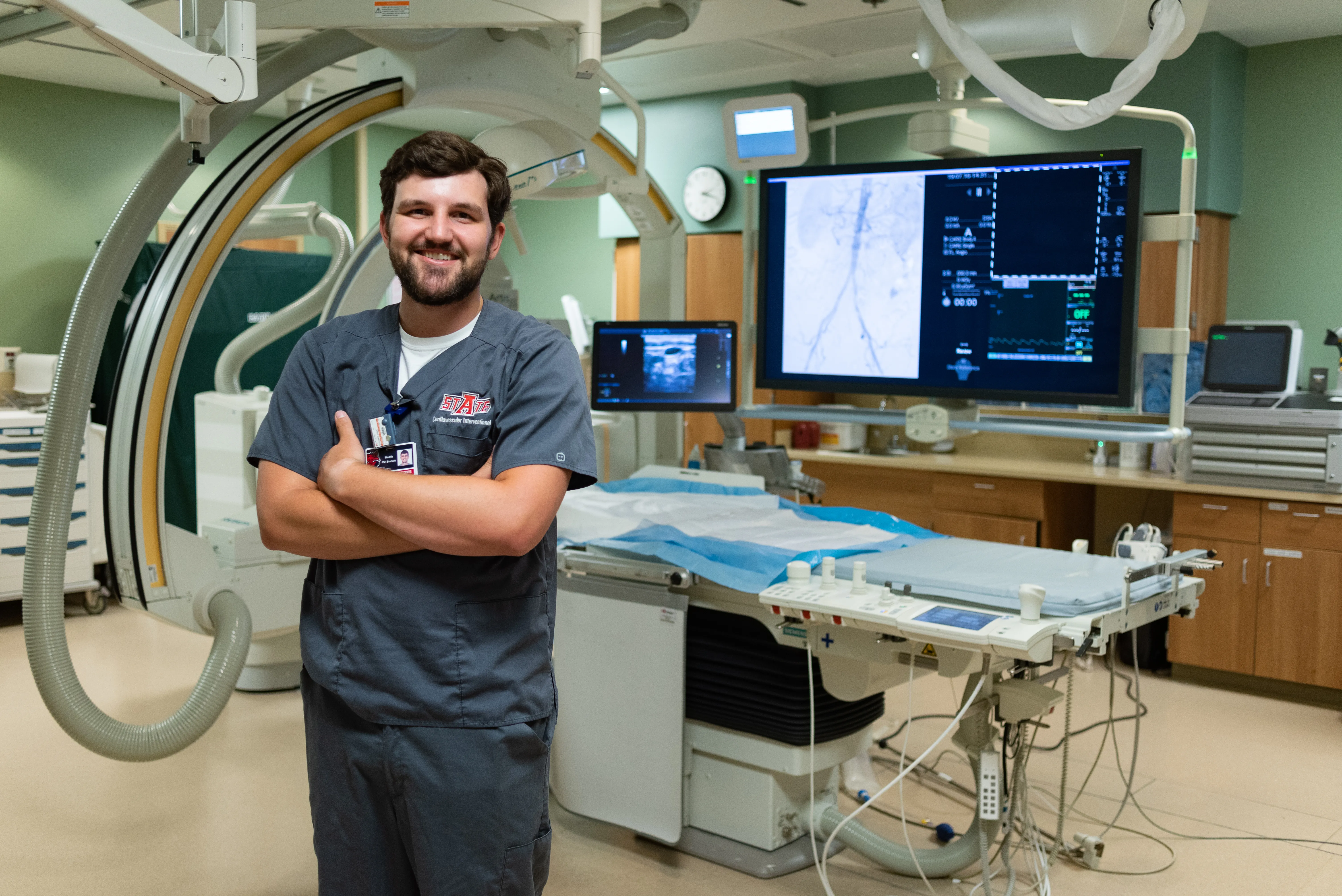 Radiology student in NEA hospital room with a new imaging machine.