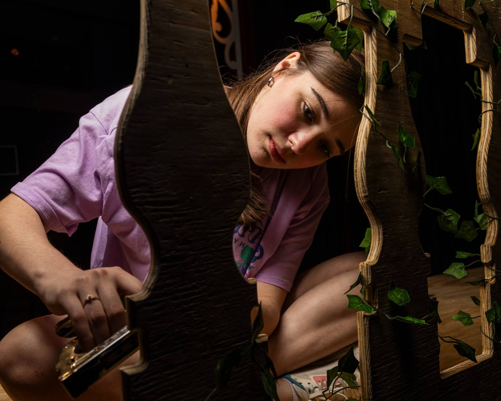 A student working on a prop for a production.