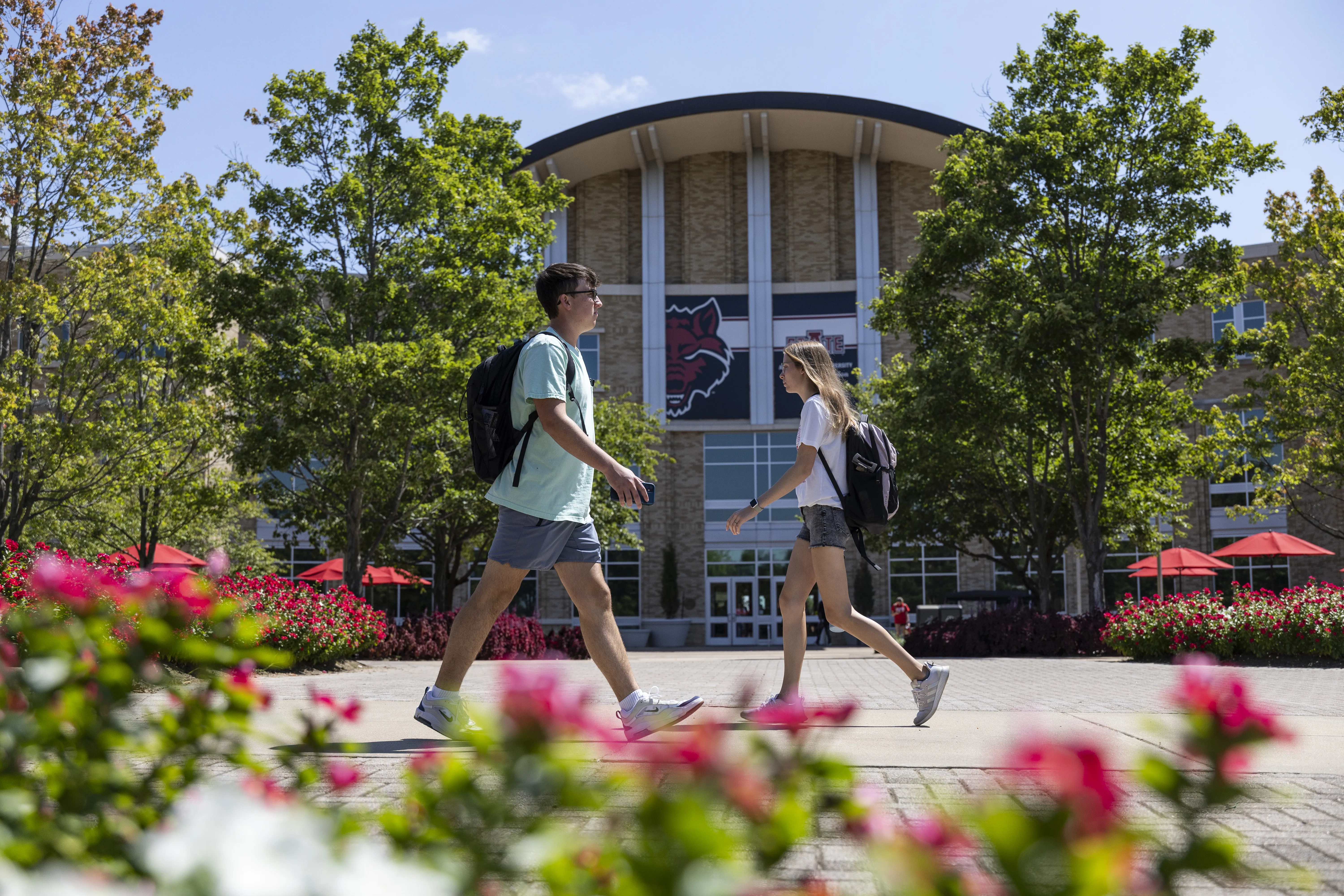 Students walking by the student center on campus