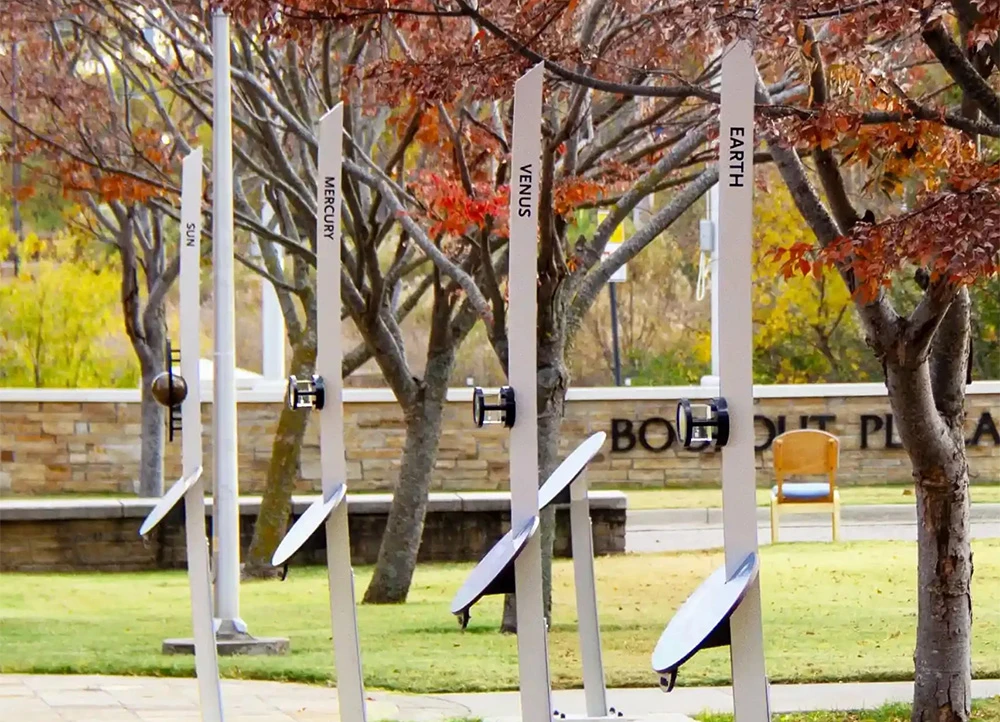 Voyage Solar System Exhibit under fall leaves