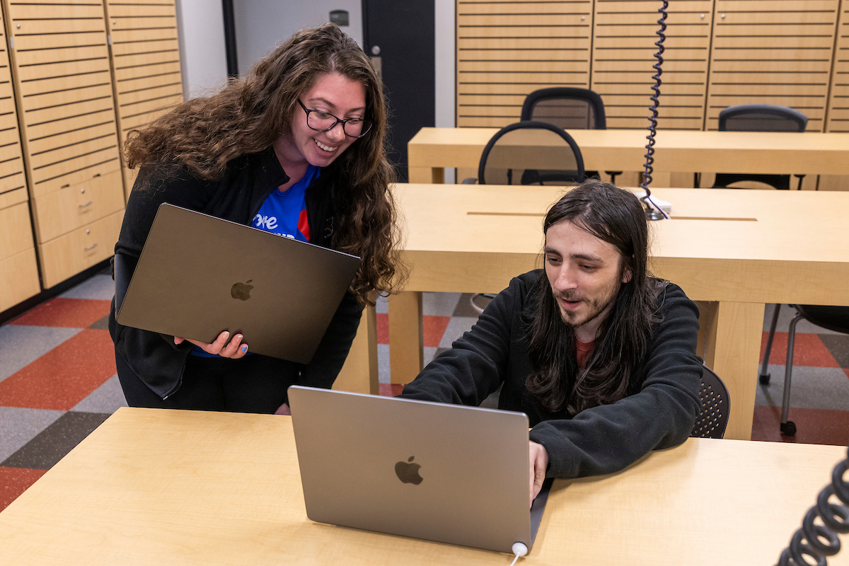 Student gets tech help inside campus IT services Help Desk.