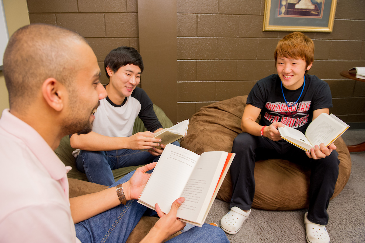 Students reading on beanbags in lounge