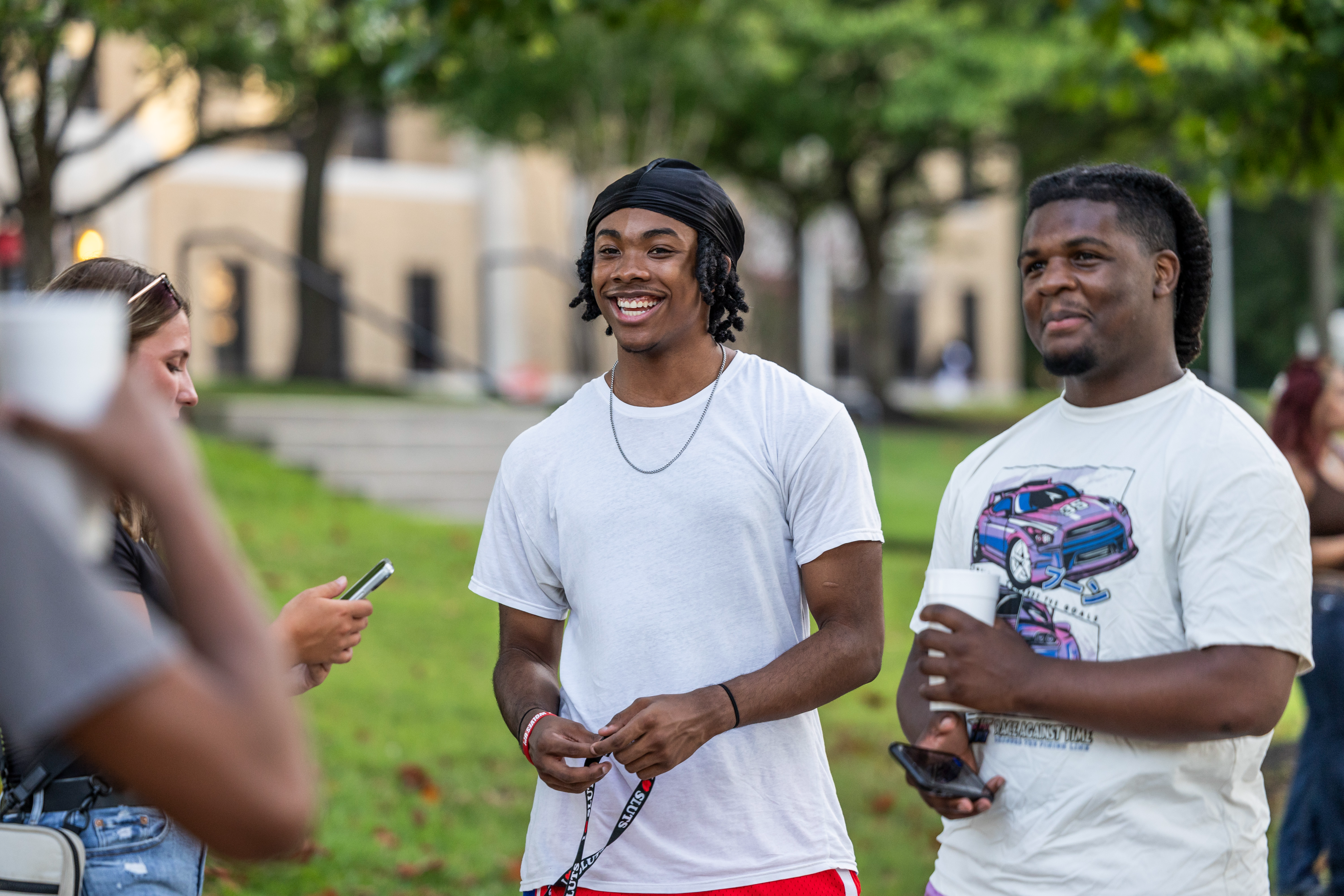 Two students smiling on the Heritage Lawn