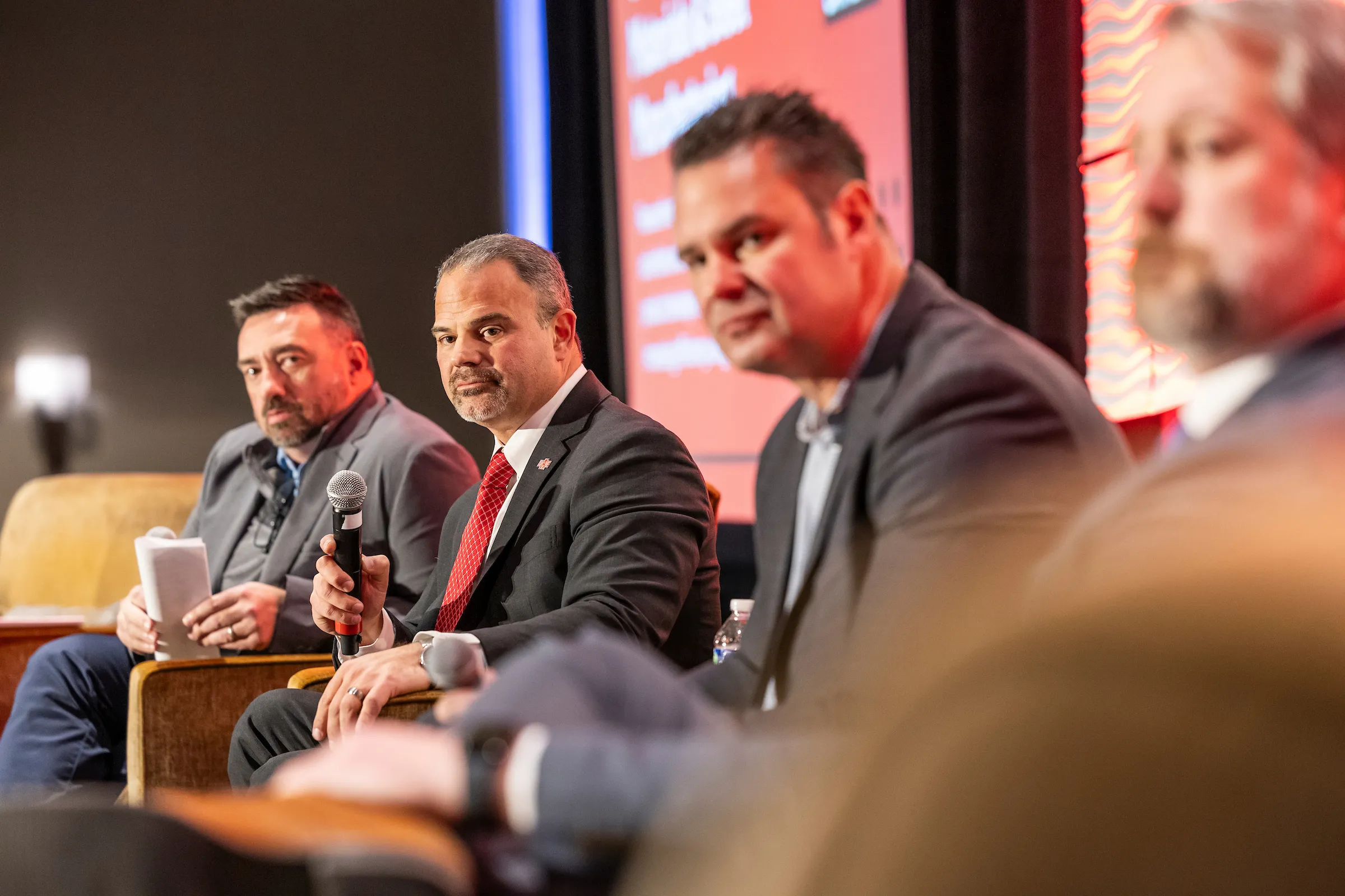 Chancellor speaks during leadership panel at Catalyst forum alongside other industry professionals.