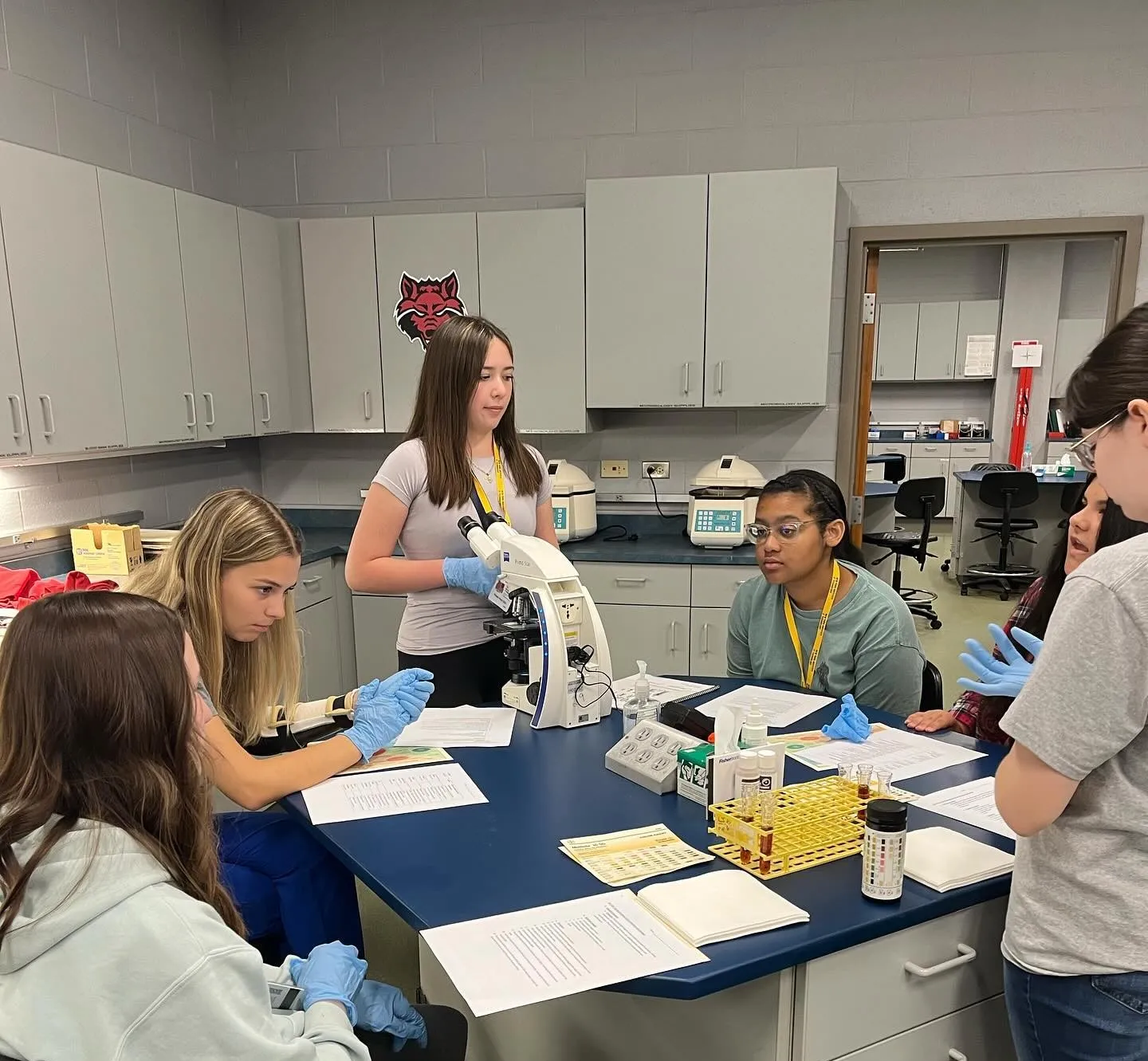 A-State students doing analyses on samples with test tubes in class.